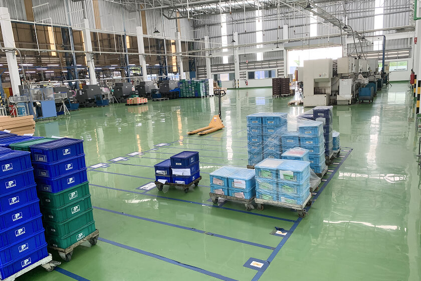 Parts boxes and machining equipment inside the Thailand factory