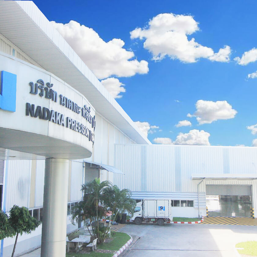 Exterior of the Thailand factory building with company signboard