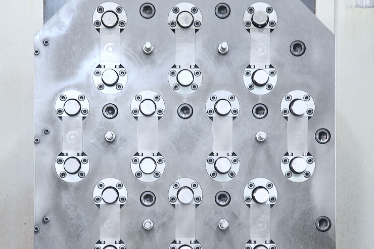 Jig holding multiple parts for mass production machining