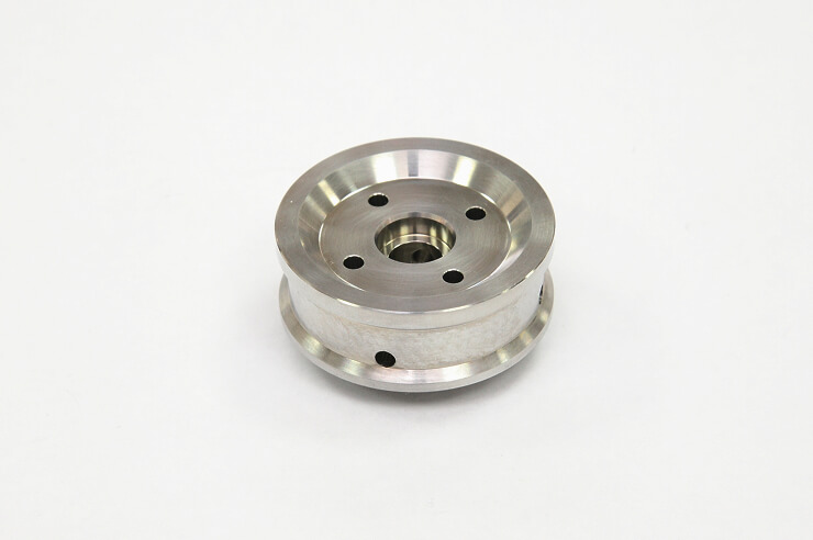 Hollow cylindrical metal part machined on a multi-tasking lathe