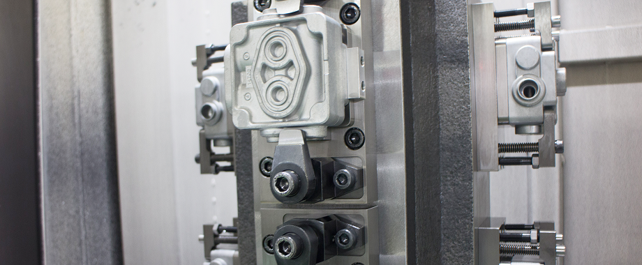 Metal part clamped in a jig for machining