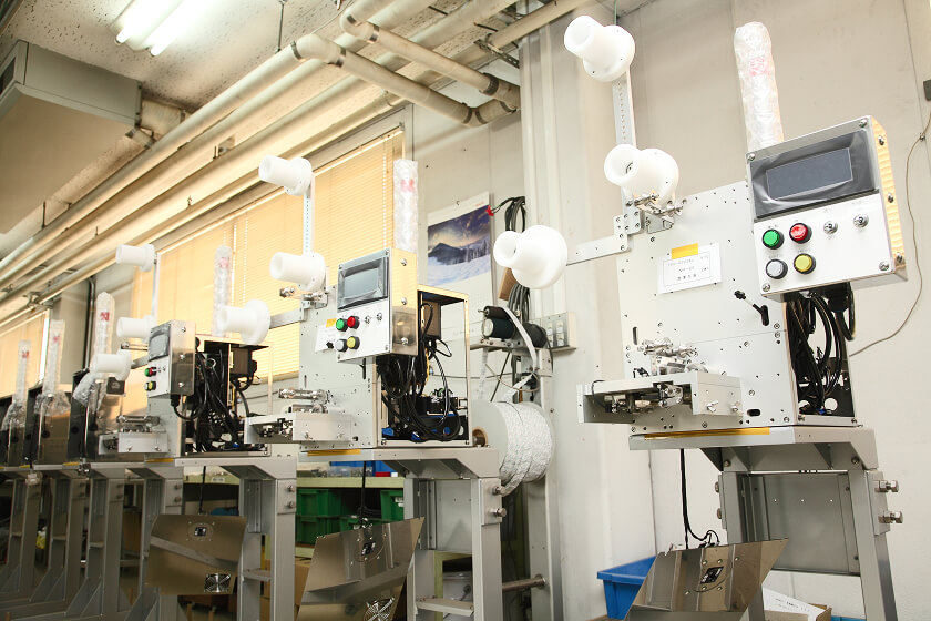 Assembly equipment and control panels lined up in the factory